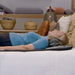 user relaxing on dr-ho’s motion solution mat at home